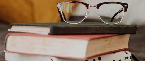 books with reading glasses