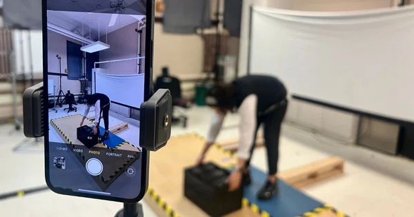 person performs a movement to assess impact on the lower back