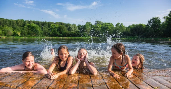 kids playing in the water on a hot day