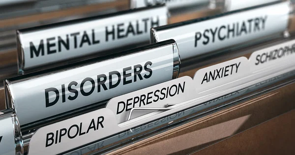 File folders labeled with mental health and psychiatric terms, organized in a filing system.