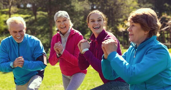Intergenerational group of people exercising, illustrating the importance of physical activity and social connection for healthy aging.