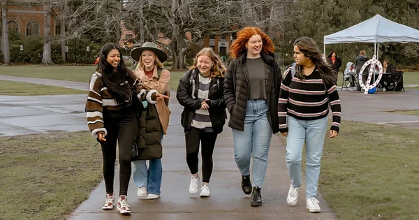 A diverse group of students enjoying campus life and social connection.
