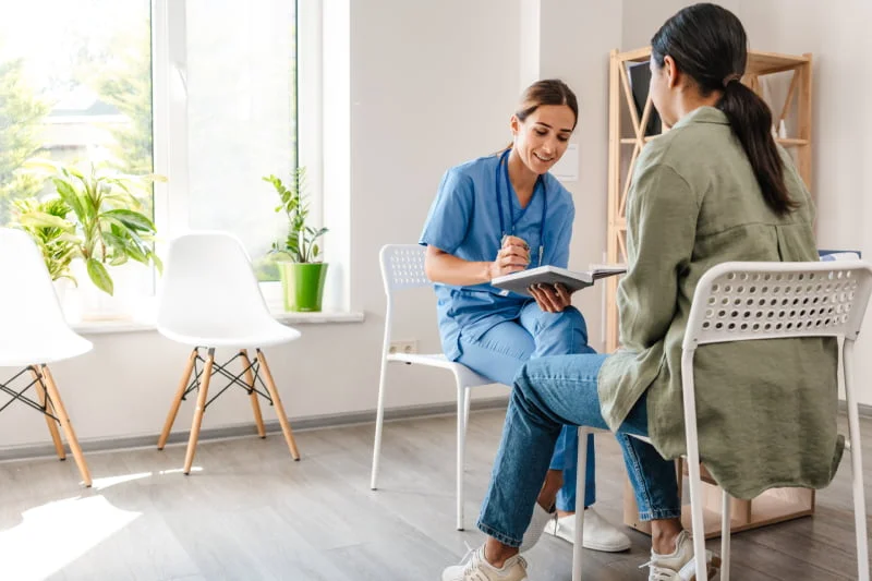 A nurse talking to patient