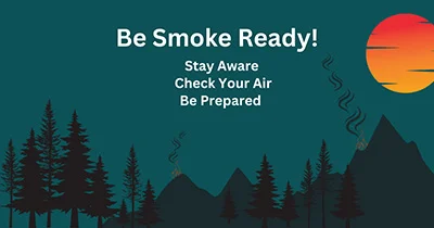 Wildfire safety poster with silhouetted forest landscape and sunset, warning about smoke preparedness.
