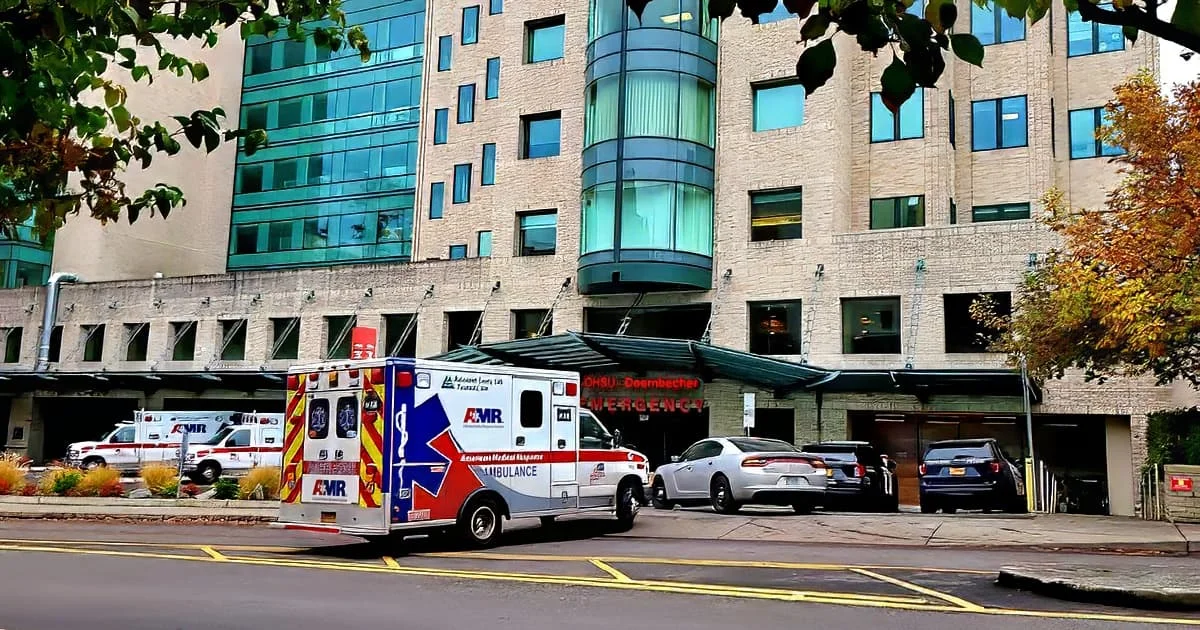 The entrance of a hospital emergency department, representing access to health care and emergency services