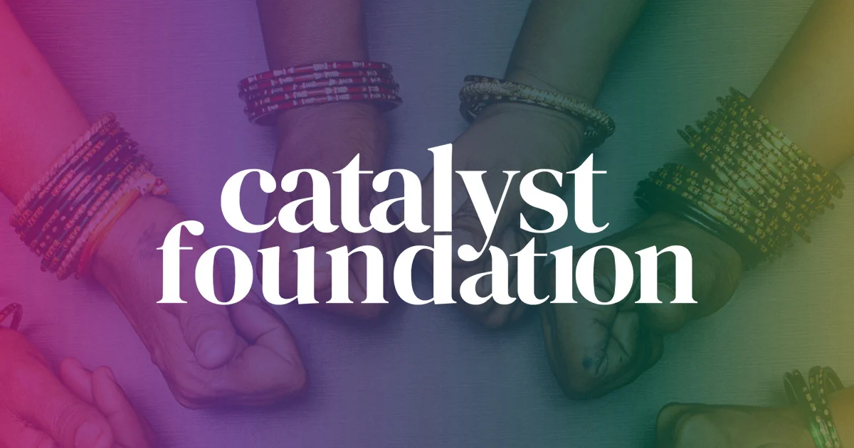 Catalyst Foundation logo. Four people's hands, adorned with traditional bangles, meet in a circle, symbolizing global collaboration and community.