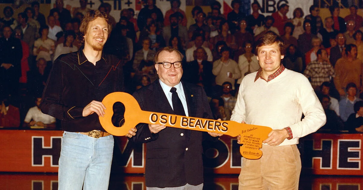 Steve Preece, ’68, and Dick Fosbury, ’72, hand a key to “Beaver Country” to Ropes 