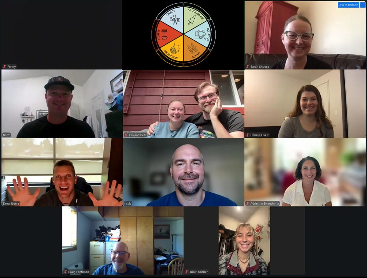 Eleven smiling participants in a video conference call, with many appearing to be in their home or office environments.
