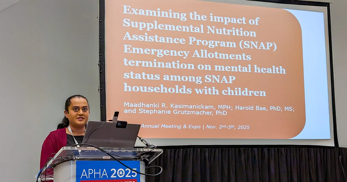A speaker at the APHA 2025 Annual Meeting & Expo delivers a public health presentation concerning the impact of changes to the SNAP program on mental health.