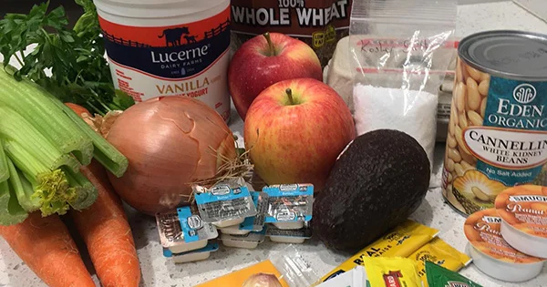 An assortment of fresh and shelf-stable food items provided in a program like Healthy Beaver Bags, illustrating food security and nutrition support.