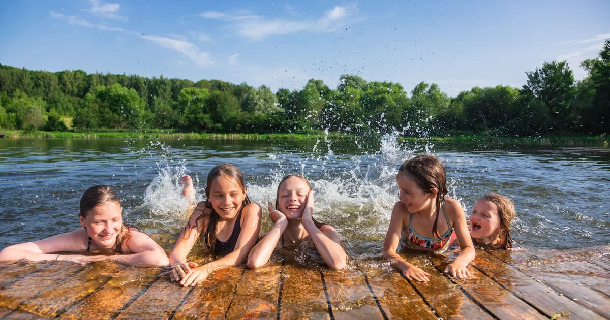 kids playing in the water on a hot day