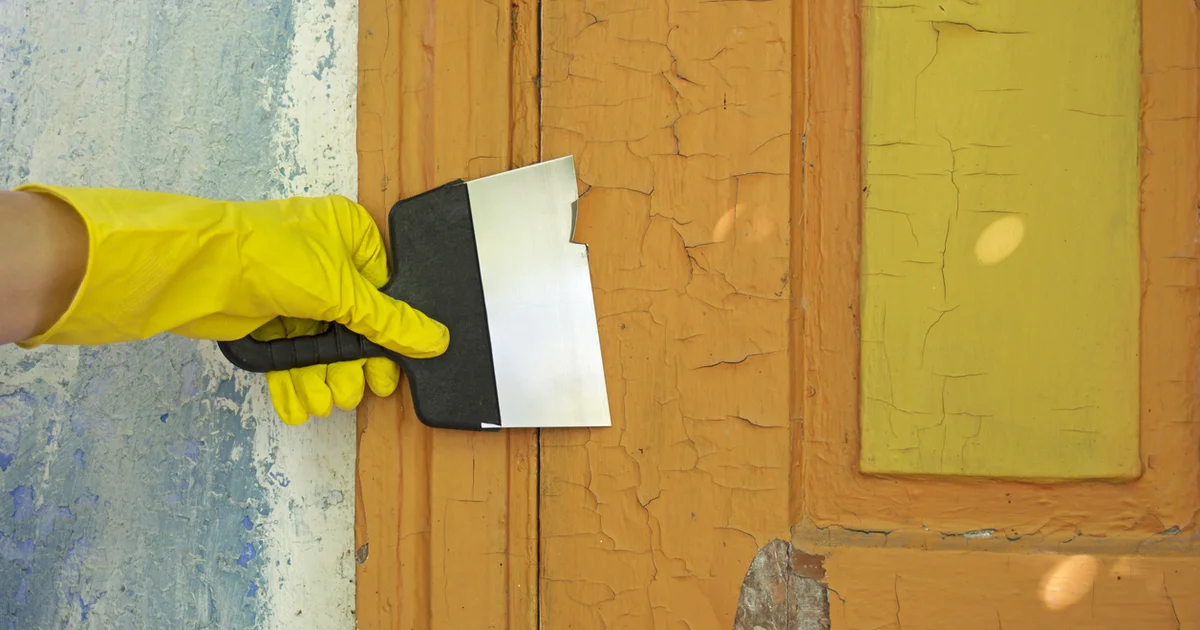 Scraping lead paint from a door