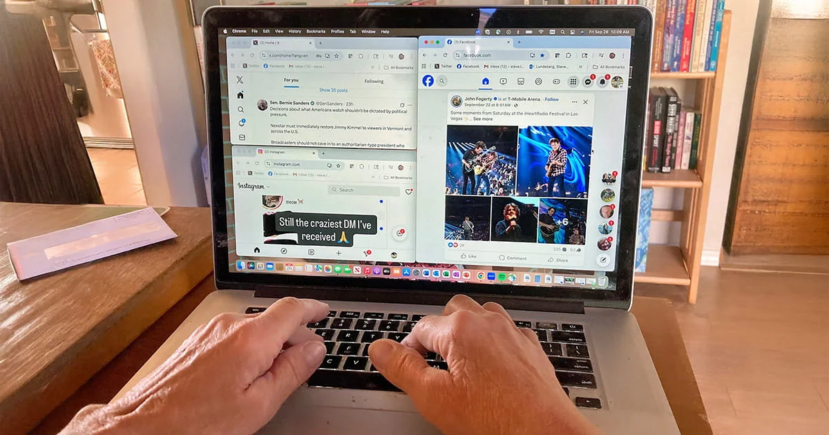 Close-up of a person's hands typing on a laptop displaying multiple browser windows open to news, social media (Facebook, Instagram), and various web tabs.
